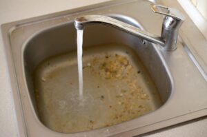Why Does My Drain Smell Like Rotten Eggs? (And When It'S A Sewer Gas Emergency) 1 Clogged Sink